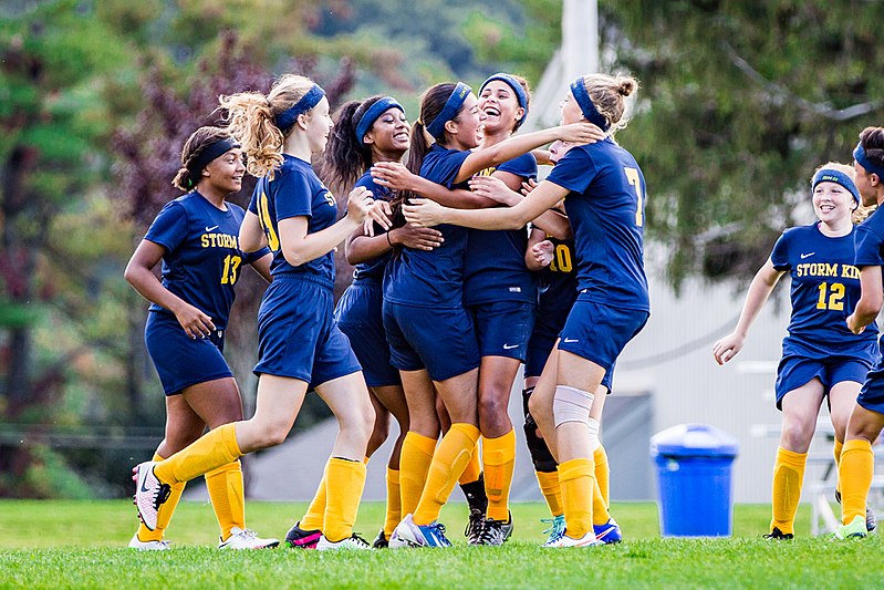 Female soccer players celebrating a win
