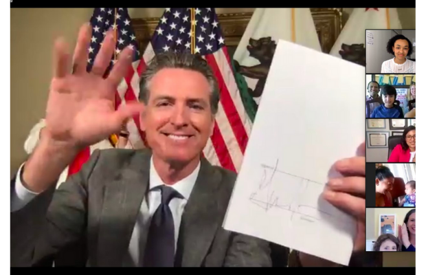 Photo of Governor Newsom signing SB 1383 during Zoom ceremony